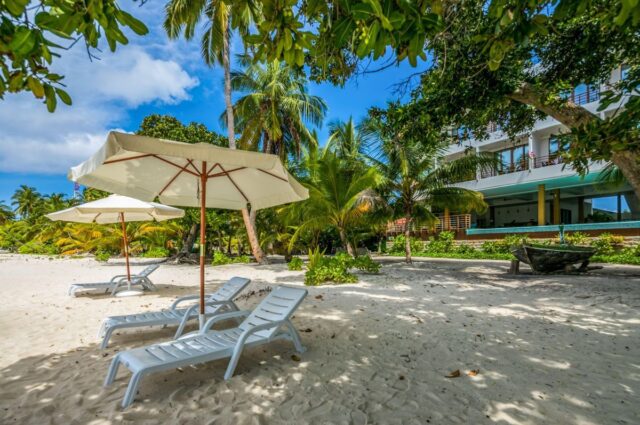 picture-dharavandhoo-kiha-beach-23 Beach loungers outside Kiha Beach Hotel in the Maldives