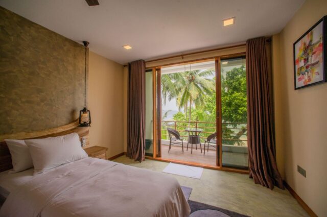 picture-dharavandhoo-kiha-beach-7 Kiha Beach Hotel surrounded by palm trees on Dharavandhoo Island